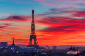 Aerial view of Eiffel tower and the rooftops of Paris during a gorgeous sunset, France