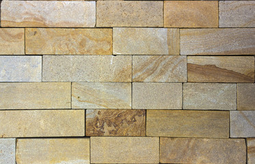 Wall of Indian sandstone with a beautiful structure, decorative building facing material