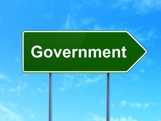 Political concept: Government on road sign background