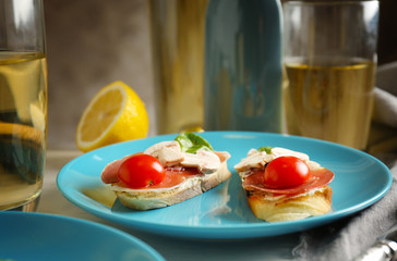 Plate with delicious bruschetta on table