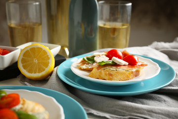 Plate with delicious bruschetta on table