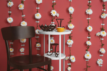 Modern room decorated with flower garland