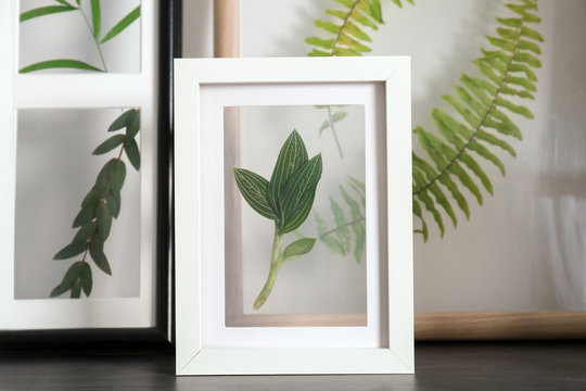 Frames with green leaves