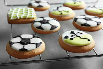 Obraz na płótnie Canvas Tasty football cookies with frosting, closeup