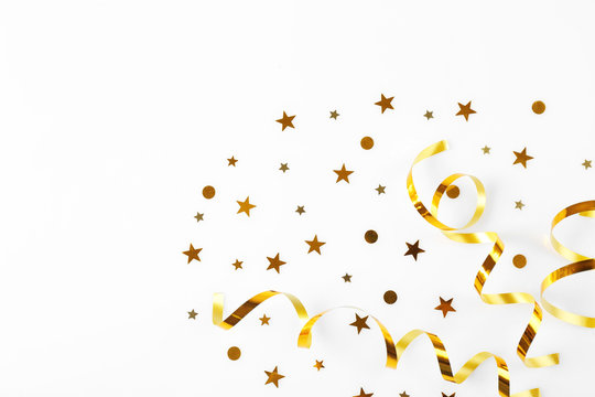 Bright confetti in shape of stars, on white background. Close up