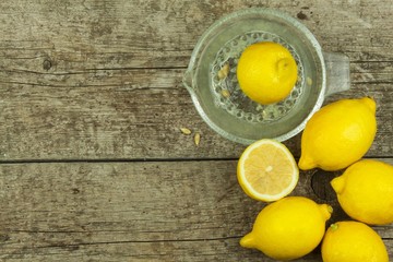Lemon, citrus fruit. Fresh and juicy lemons on old wooden table. Tropical fruit full of vitamin C.