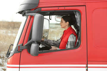 Young woman driving big modern truck