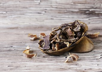jerked meat, cow, deer, wild beast or biltong in wooden bowls on a rustic table