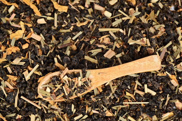 loose leaf organic tea in wood spoon