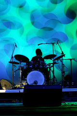 Drum player silhouette on the stage