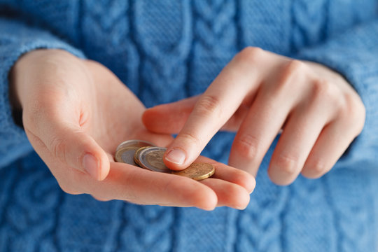 Woman conside nickel money