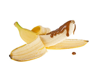 Banana in caramel sauce on a white background