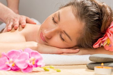 Plakat Horizontal portrait of a young woman closeup a massage at the sp