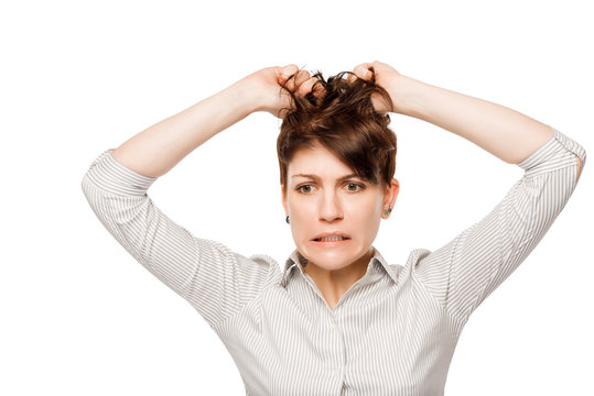 Frustrated angry woman tearing hair on his head isolated on whit