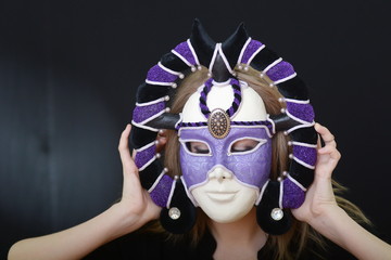 blonde with a theatrical mask