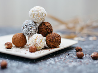 hand-made vegan truffles and candies with coconut and pumpkon