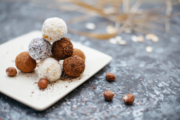 hand-made vegan truffles and candies with coconut and pumpkon