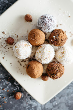 hand-made vegan truffles and candies with coconut and pumpkon