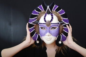 blonde with a theatrical mask