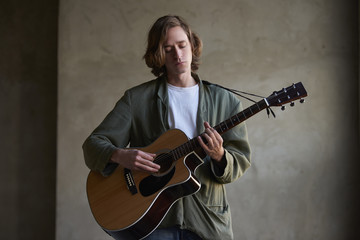 Young talent playing guitar