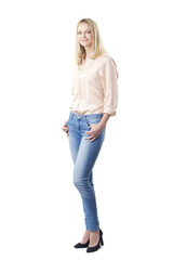 Fototapeta premium Confident mature female portrait. Full length shot of a smiling middle aged woman wearing casual clothing while standing at isolated white background. 