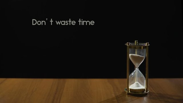 Don't waste time, popular phrase about life value and transience, sandglass