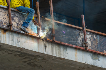 Metal work ..Worker are welding steel at construction site.
