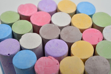 Fototapeta na wymiar Macro picture of chalks in a variety of colors on a white backgr