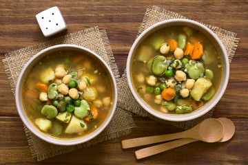 Vegetarian chickpea soup with carrot, broad bean (fava bean), pea, potato, onion, garlic and...