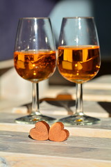 The rosé wine glasses and hearts for a special evening