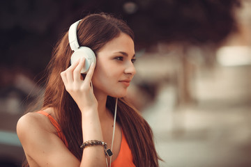 Fototapeta premium Portrait of Latin girl with headphones