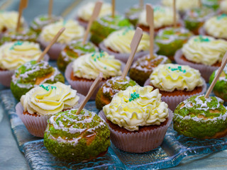 Delicious sweet holiday buffet with cupcakes, meringues and other desserts