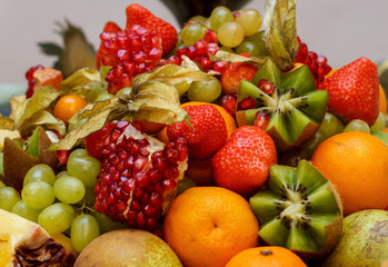 full glass vase of ripe tasty fruit
