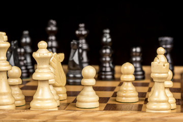 Pieces on a chess board close up
