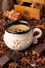 Cup of coffee  and coffee beans  and old grinder