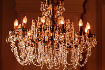 elegant chandelier with light bulbs close-up. horizontal Photo