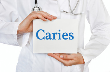 Caries card in hands of Medical Doctor