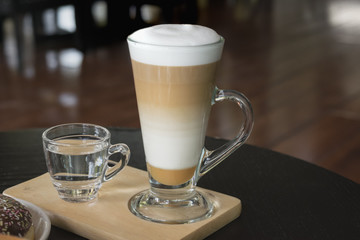 Selective focus white cup of Coffee, latte on the wooden table.