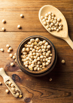 Portion of Chick Peas in wooden bowl with spoon