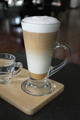 Selective focus white cup of Coffee, latte on the wooden table.