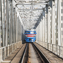 train traveling on the iron bridge