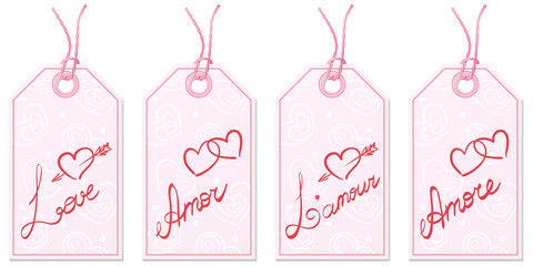 Set of four gift tags with handwritten word Love in English, Spanish, French and Italian on pink paper