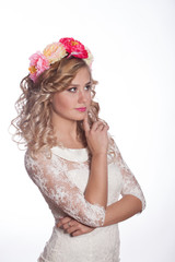 Fototapeta premium young and beautiful blonde with a wreath of flowers in her hair