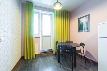 Cozy modern dining room and a door to the balcony