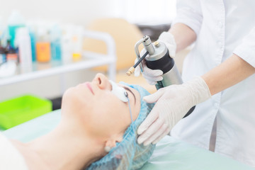 liquid nitrogen. Doctor makes the patient cryotherapy procedure