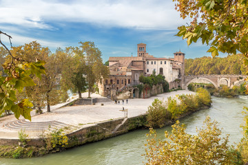 Fototapeta na wymiar Rome, Italy. Tiberina Island in the Tiber river and the Pons Fabricius is the oldest surviving bridge in Rome. built in 62 BC