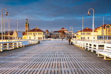 Cold morning, Pier in Sopot at sunrise with amazing colorful sky. Winter in Poland.