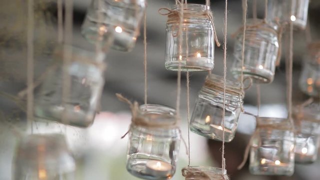 mason jar candle hanging on tree for wedding decor