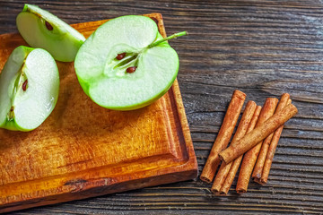 Ripe green apples on wooden background