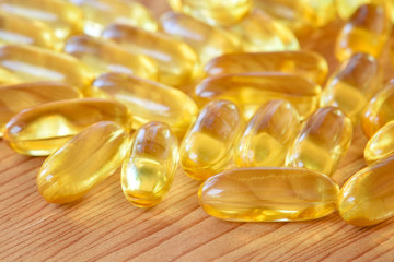 Closeup fish oil omega3 on plank